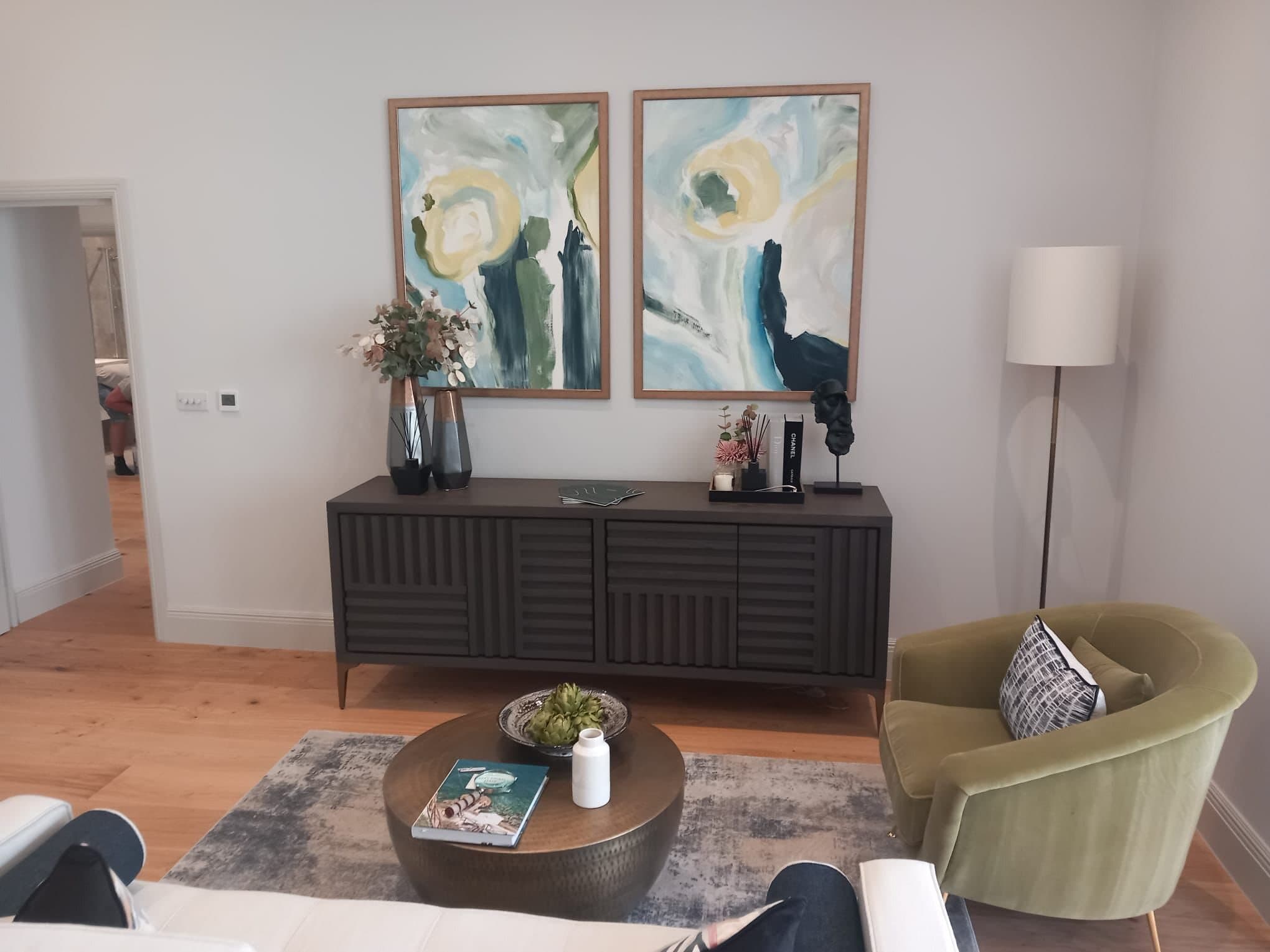Finished living room with oak floor and styled furniture