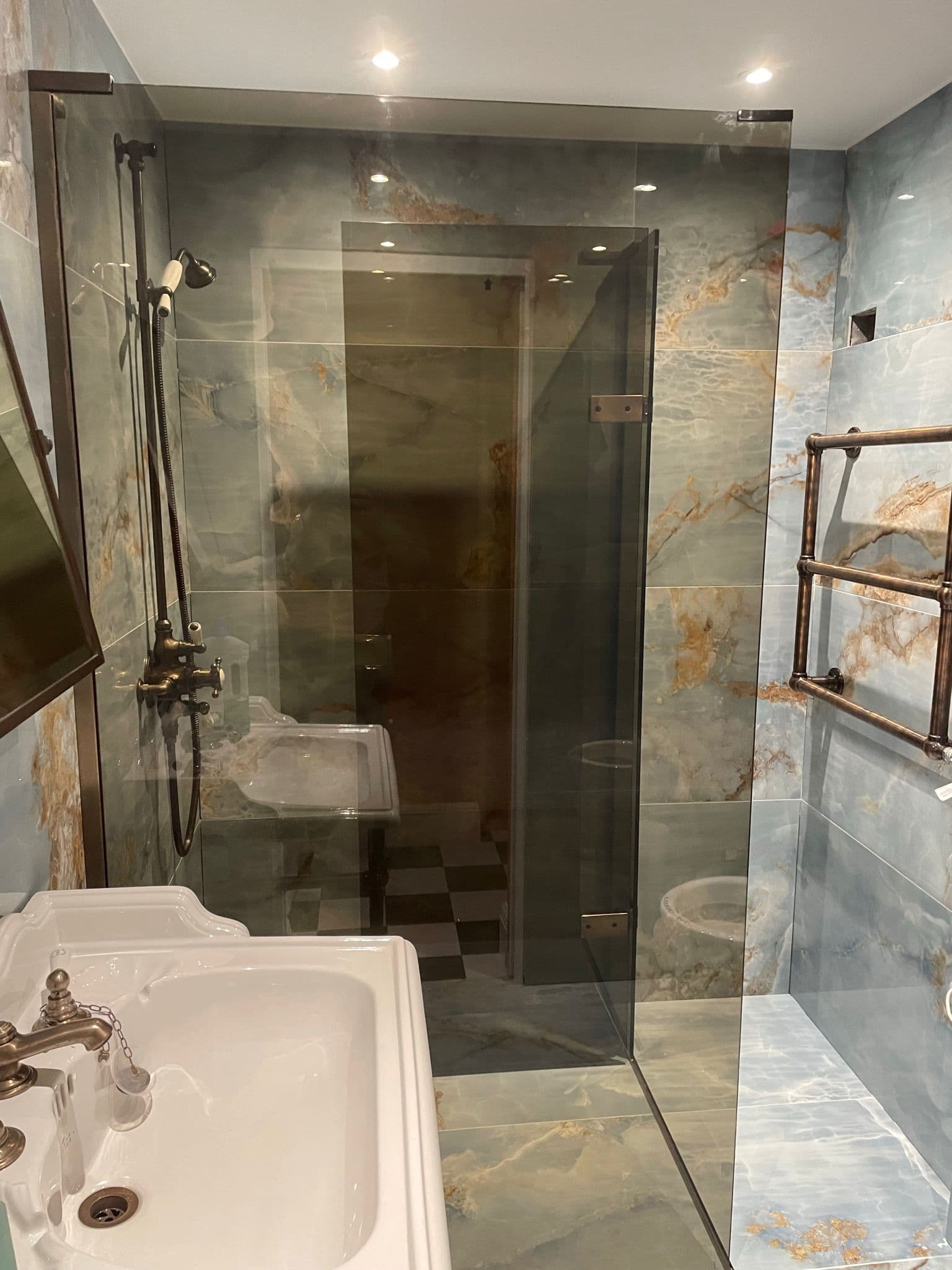 Finished bathroom with marble-effect wall finish