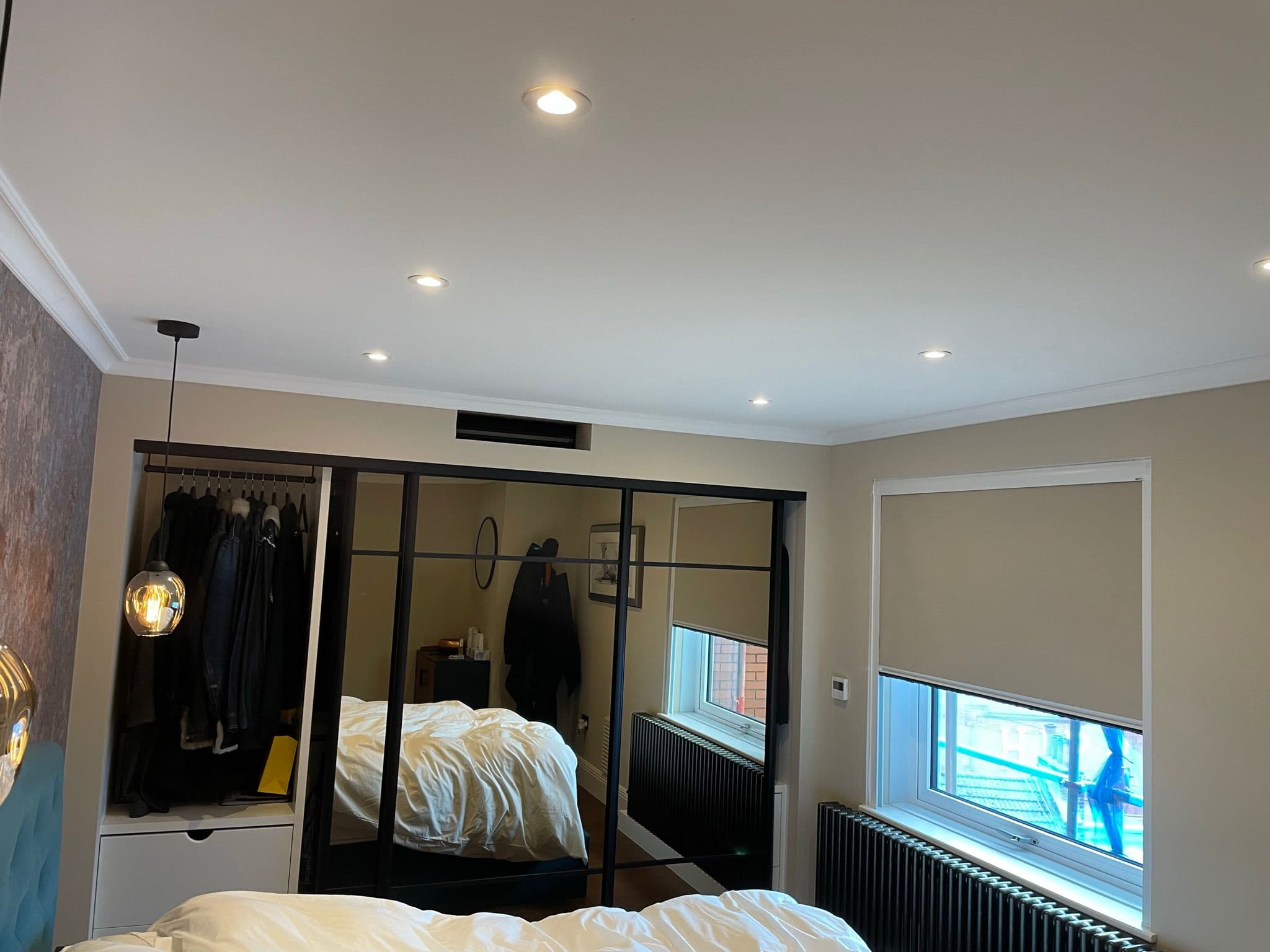 Bedroom with fitted mirrored wardrobe