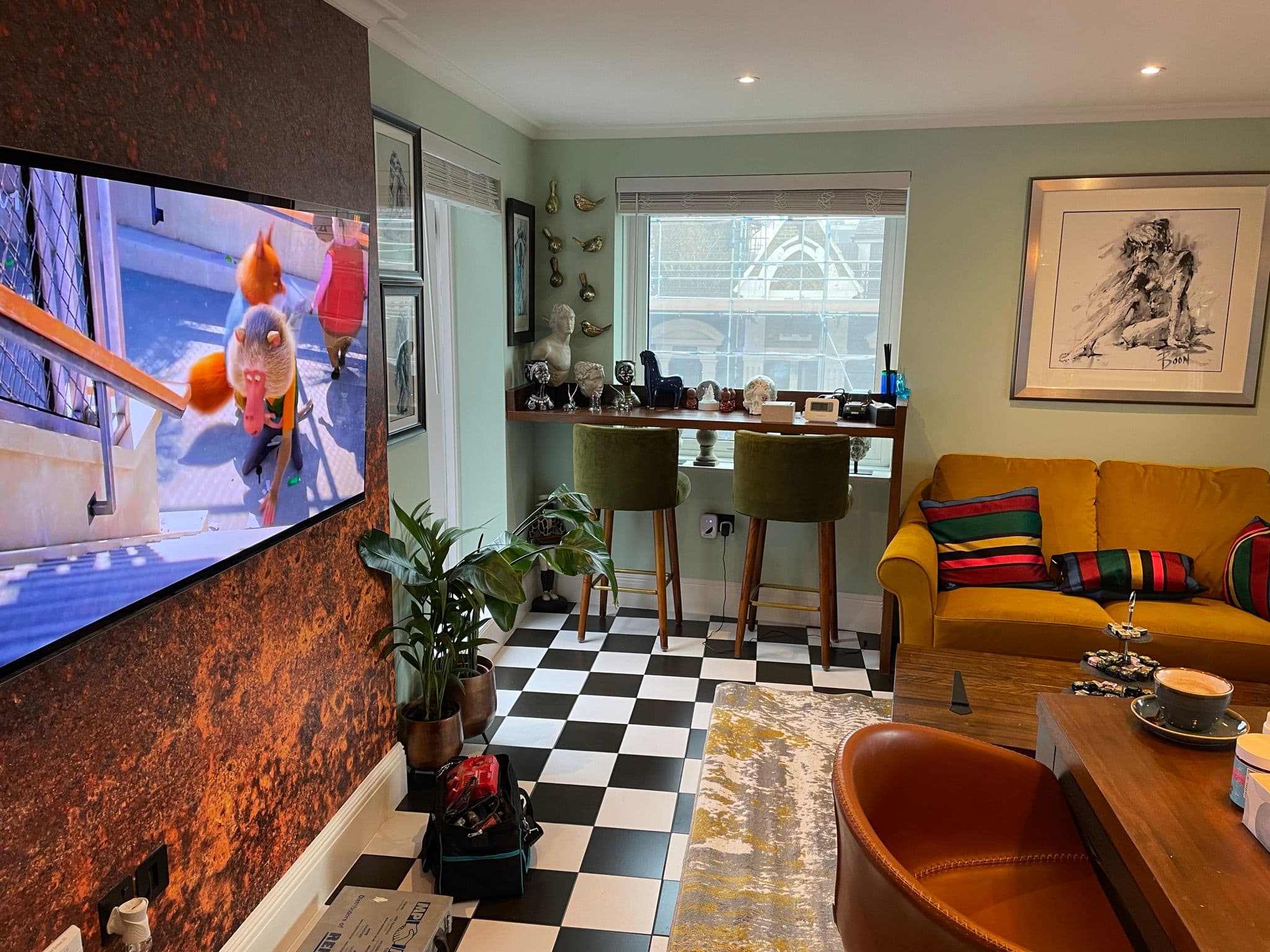 Wider view of kitchen and living area